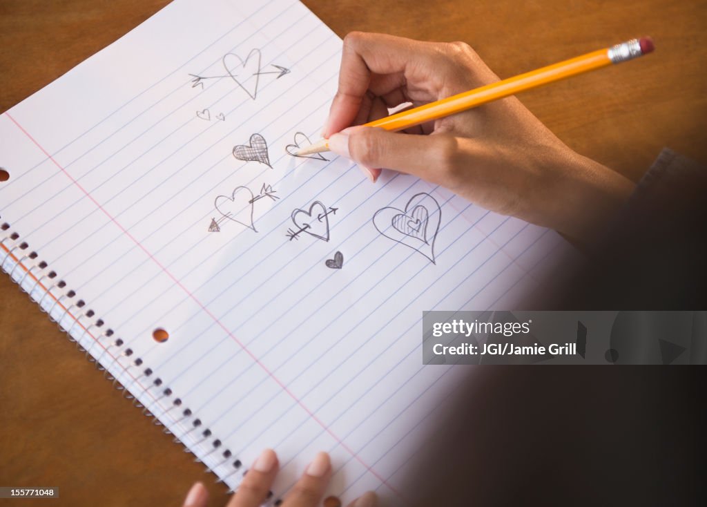 Cape Verdean woman doodling hearts