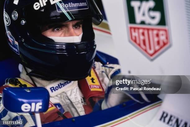 Damon Hill from Great Britain checks the lap times on the monitor from the cockpit of the Rothmans Williams Renault Williams FW16B Renault V10 during...