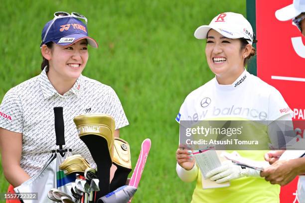 Chisato Iwai of Japan and Mone Inami of Japan smile during the first round of DAITO KENTAKU eheyanet Ladies at the Queen's Hill Golf Club on July 20,...