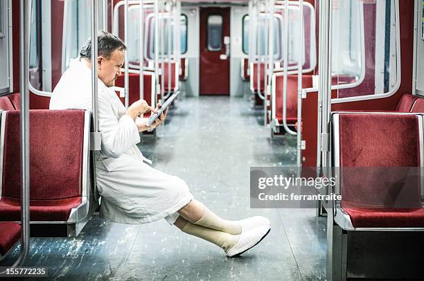 early commuter on the train - funny slipper stock pictures, royalty-free photos & images