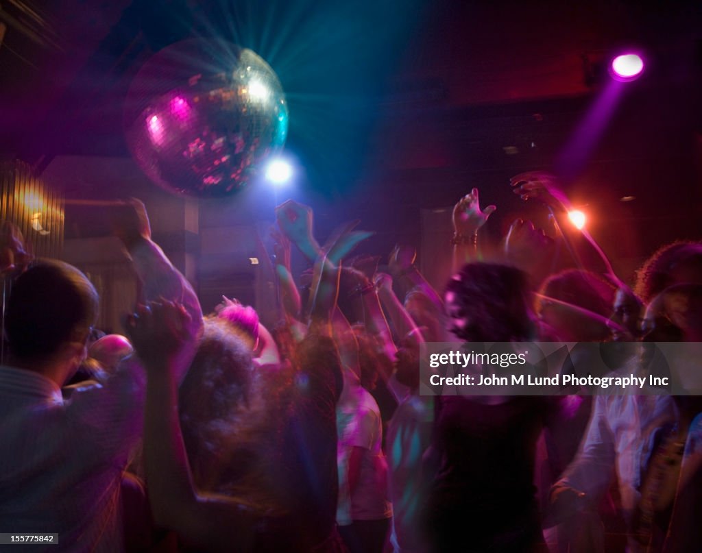 Hispanic people dancing in nightclub