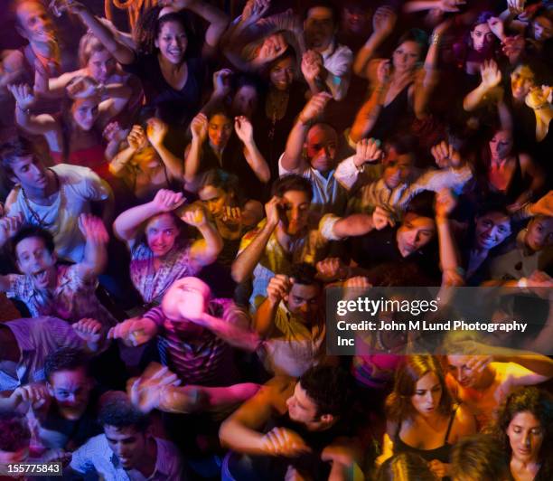 hispanic people dancing in nightclub - crowd of people above stock pictures, royalty-free photos & images