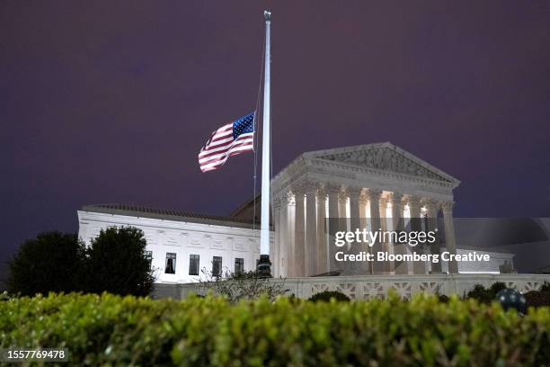 an american flag outside the u.s. supreme court - half mast stock pictures, royalty-free photos & images