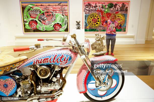 Sir Grayson Perry poses during a photo call for his Smash Hits exhibition being held in Royal Scottish Academy on July 20, 2023 in Edinburgh,...