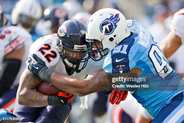 Derrick Morgan of the Tennessee Titans tackles Matt Forte of the Chicago Bears at LP Field on November 4, 2012 in Nashville, Tennessee. The Bears...