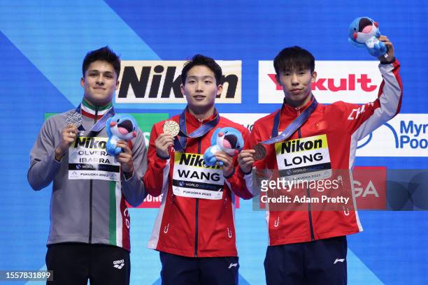 Silver medalist Osmar Olvera Ibarra of Team Mexico, Gold medalist Zongyuan Wang of Team China and Bronze medalist Daoyi Long of Team China pose...
