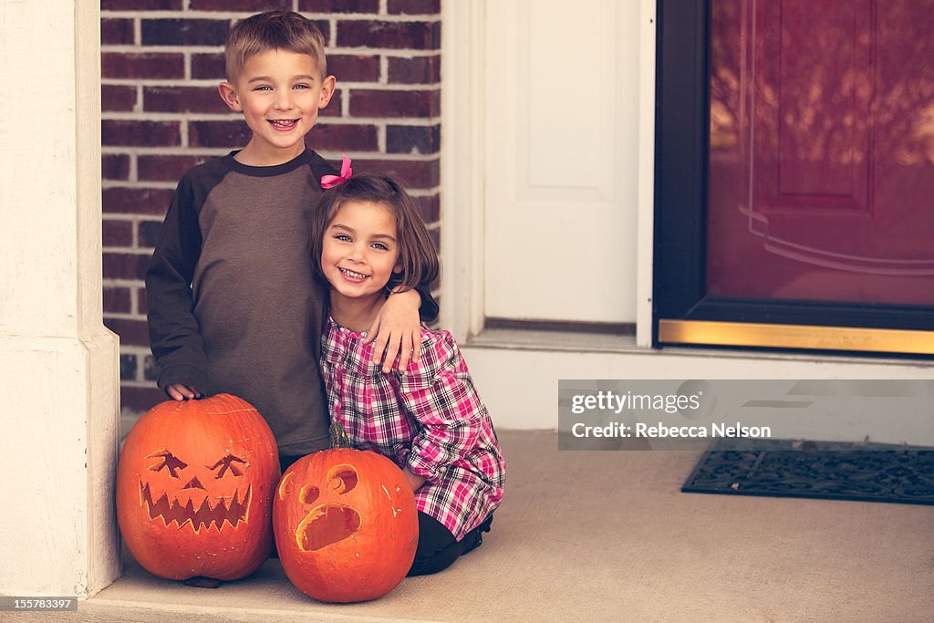 Boy and girl with their jack o lanterns