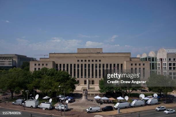Media tents and television satellite trucks are set up outside the E. Barrett Prettyman U.S. District Court House on July 27, 2023 in Washington, DC....
