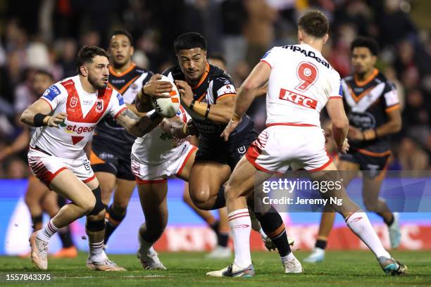 Fonua Pole of the Tigers hits the ball up during the round 21 NRL match between St George Illawarra Dragons and Wests Tigers at WIN Stadium on July...