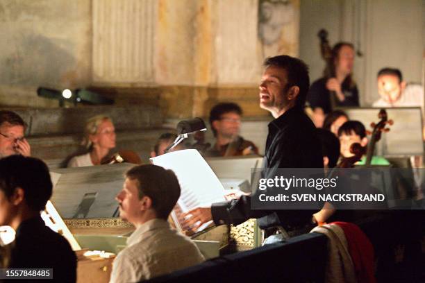 French conductor Christophe Rousset directs the musicians 27 July 2005, during repetitions for the opera of Jean-Philippe Rameau's "Zoroastre" that...
