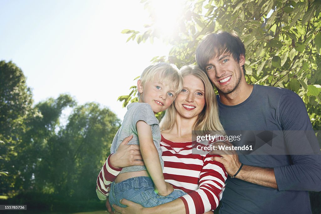 Germany, Cologne, Family smiling, portrait