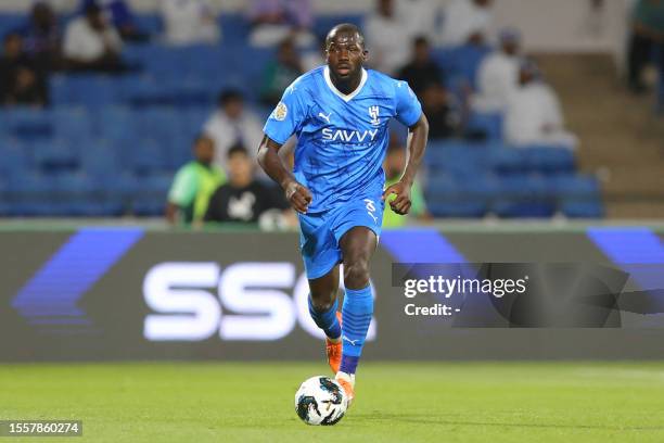 Hilal's Senegalese defender Kalidou Koulibaly runs with the ball during the 2023 Arab Club Champions Cup group B football match between Libya's...