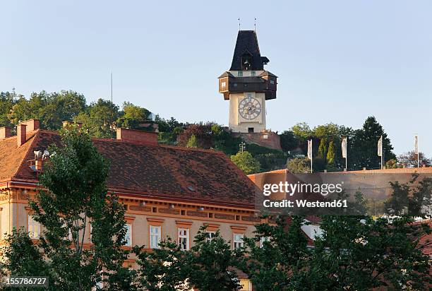 austria, styria, graz, view of clock tower on schlossberg hill - graz stock-fotos und bilder