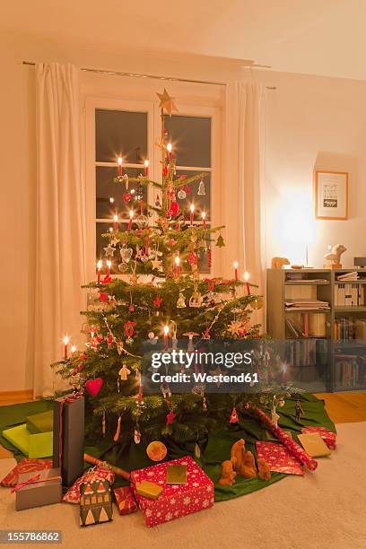 germany, baden wuerttemberg, stuttgart, christmas gift under christmas tree - christmas stuttgart stock pictures, royalty-free photos & images