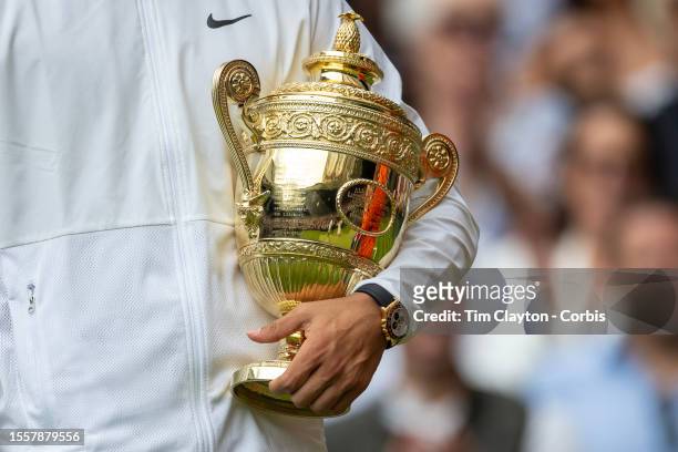Carlos Alcaraz of Spain with the winners trophy after his victory against Novak Djokovic of Serbia in the Gentlemen's Singles Final match on Centre...
