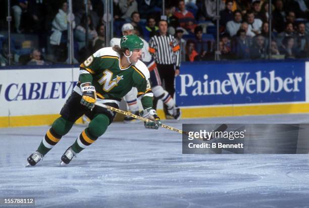 Mike Modano of the Minnesota North Stars skates on the ice during an NHL game against the New York Islanders on February 12, 1991 at the Nassau...