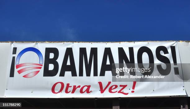 Banner at the Democratic Party's headquarters in Espanola, New Mexico, urges residents to vote for Barack Obama in the 2012 presidential election. A...