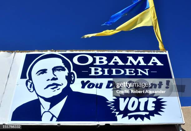 Sign at the Democratic Party's headquarters in Espanola, New Mexico, urges residents to vote for Barack Obama in the 2012 presidential election. A...