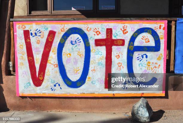 Sign at the Democratic Party's headquarters in Espanola, New Mexico, urges residents to vote a few days before the 2012 presidential election. A...