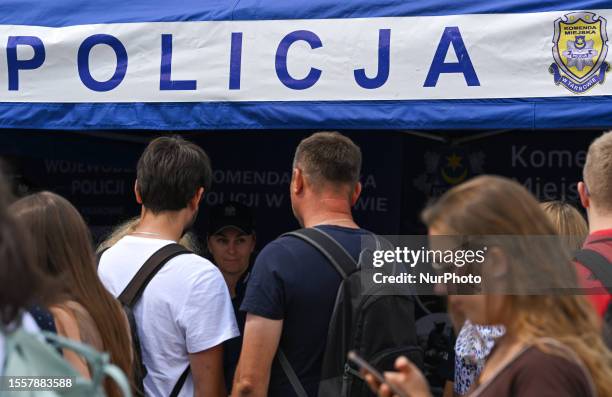 Members of the public at the Police stand in the Market Square during the celebration of the Police Day in Lesser Poland Province held in Krakow, on...