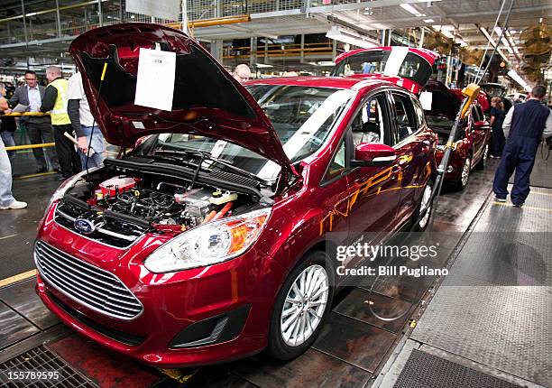 Ford workers assemble a C-MAX hybrid vehicle at the Michigan Assembly Plant November 8, 2012 in Wayne, Michigan. The plant is the only one in the...
