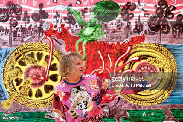 Sir Grayson Perry poses during a photo call for his Smash Hits exhibition being held in Royal Scottish Academy on July 20, 2023 in Edinburgh,...