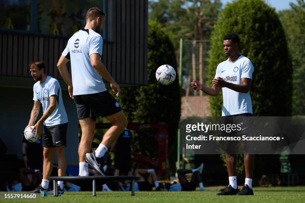 Denzel Dumfries of FC Internazionale and Stefan De Vrij of FC Internazionale in action during the FC Internazionale training session at the club's...