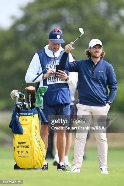 Tommy Fleetwood of England looks on alongside caddy Ian Finnis during Day One of The 151st Open at Royal Liverpool Golf Club on July 20, 2023 in...