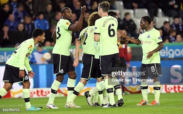 Shola Ameobi celebrates with teammates after scoring his team's second goal during the UEFA Europa League group D match between Club Brugge KV and...