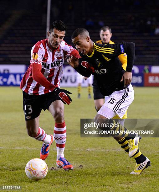 Eindhoven's Bulgarian defender Stanislav Manolev and AIK Solna's midfielder Robin Quaison vie for the ball during the UEFA Europa League Group F...