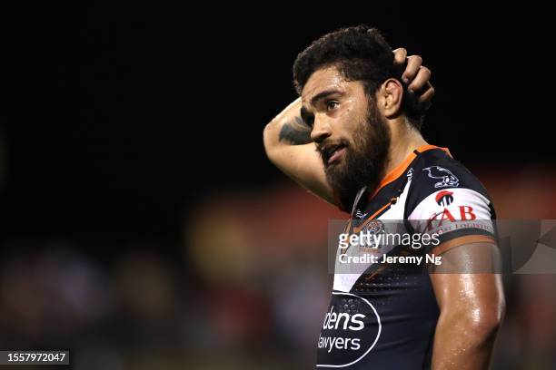 Isaiah Papali’i of the Tigers reacts after full time during the round 21 NRL match between St George Illawarra Dragons and Wests Tigers at WIN...