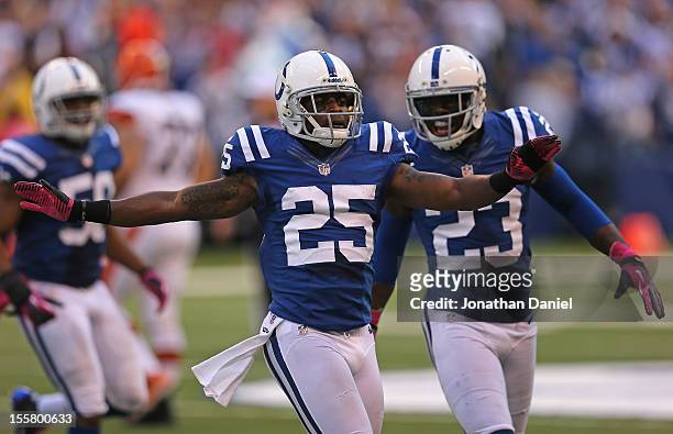 Jerraud Powers of the Indianapolis Colts celebrates breaking up a pass near the end of a game with Vontae Davis against the Cleveland Browns at Lucas...
