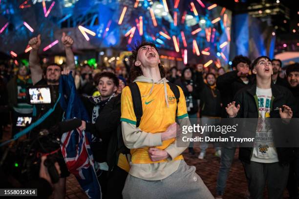 Australian fans celebrate their teams win as they watch the opening FIFA Women's World Cup Australia & New Zealand 2023 Group B match between...