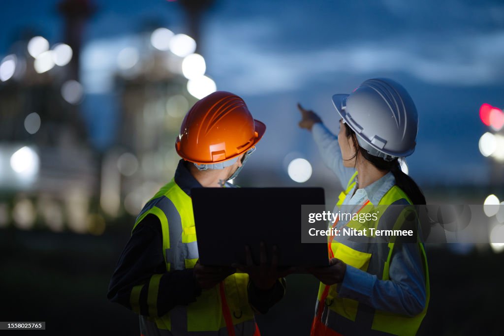 Operations and Maintenance Service In Field Support for Energy Generation. Rear View of Field Support Engineers working in a Power Plant to diagnose and enhanced plant performance during on-site service.