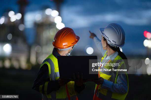 operations and maintenance service in field support for energy generation. rear view of field support engineers working in a power plant to diagnose and enhanced plant performance during on-site service. - reliable bildbanksfoton och bilder