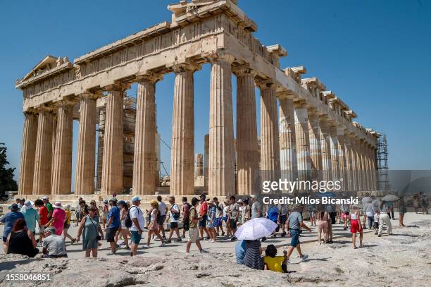 Atop the Acropolis ancient hill with Parthenon temple during a heat wave on July 20, 2023 in Athens, Greece. The Acropolis of Athens and other...