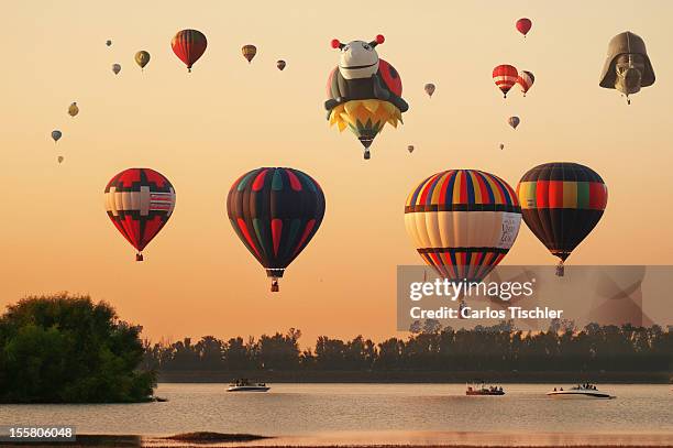 Hot air balloons fly across the sky during de 11th Balloon Festival 2012 on November 08, 2012 in Guanajuato, Mexico. This is the largest ballooning...