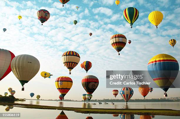 Hot air balloons fly across the sky during de 11th Balloon Festival 2012 on November 08, 2012 in Guanajuato, Mexico. This is the largest ballooning...