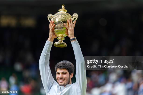 Carlos Alcaraz of Spain with the winner's trophy after his victory against Novak Djokovic of Serbia in the Gentlemen's Singles Final match on Centre...