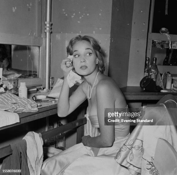 Actress Sylvia Syms removes her makeup in a dressing room during the 'Night of 100 Stars' charity performance, London Palladium, July 22nd 1959....