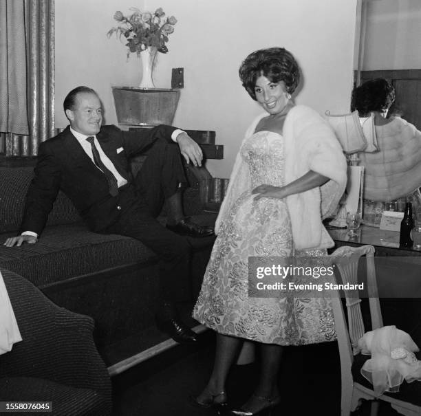 American entertainer Bob Hope with singer Alma Cogan backstage during the 'Night of 100 Stars' charity performance, London Palladium, July 22nd 1959.