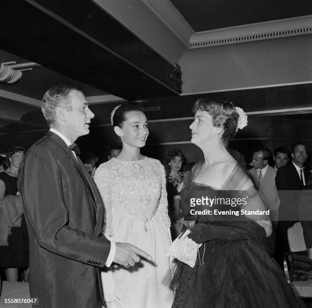 Actors Sir Laurence Olivier , Audrey Hepburn and Dame Peggy Ashcroft during the 'Night of 100 Stars' charity performance, London Palladium, July 22nd...