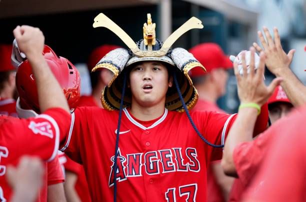 Shohei Ohtani of the Los Angeles Angels celebrates with teammates after hitting a home run during the fourth inning of game two of a doubleheader at...