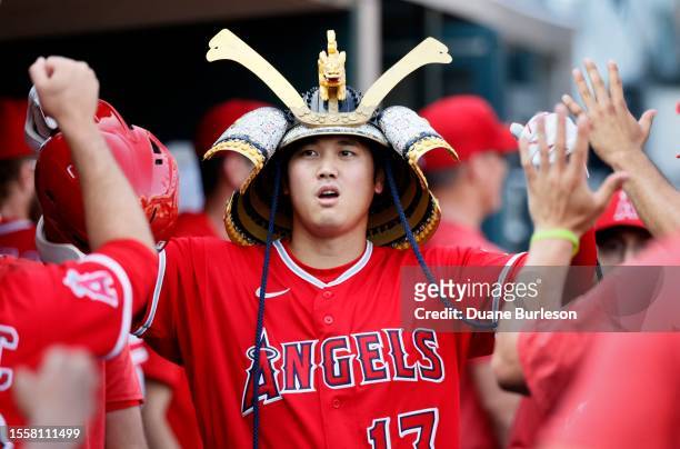 Shohei Ohtani of the Los Angeles Angels celebrates with teammates after hitting a home run during the fourth inning of game two of a doubleheader at...