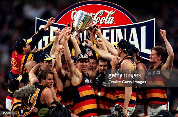 The Adelaide Crows team celebrates their victory over the Kangaroos in the 1997 AFL Grand Final at the MCG in Melbourne, Australia. Mandatory Credit:...