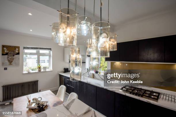 property interiors - hanging lamp stock pictures, royalty-free photos & images