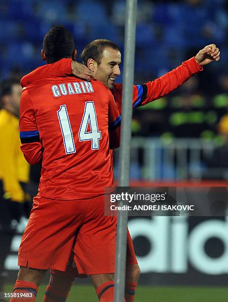 Inter Milan's Rodrigo Palacio celebrates after scoring a goal, with his teammate Fredy Guarin, during the UEFA Europa League group H football match...