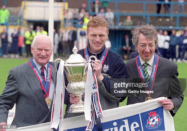 Tom Finney and Preston North End manager David Moyes lift the Division Two trophy after the Nationwide League Division Two match against Millwall at...