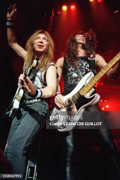 Guitarist and bass player Janick Gers and Steve Harris of the British Heavy metal band Iron Maiden perform on April 25, 1993 in Bourges, central...