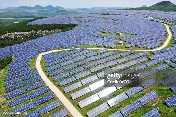 Aerial view of solar panels at a photovoltaic power station on July 19, 2023 in Zaozhuang, Shandong Province of China.